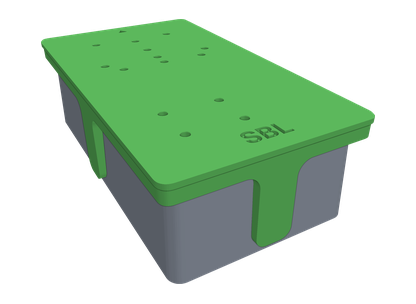 A 3D printed drill jig sitting over a pedal enclosure, with holes over each drilling position and a wall wrapping onto the side.