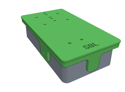 A 3D printed drill jig sitting over a pedal enclosure, with holes over each drilling position and a wall wrapping onto the side.